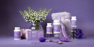 Purple-themed products including bottles, a vase with flowers, and a box on a purple background
