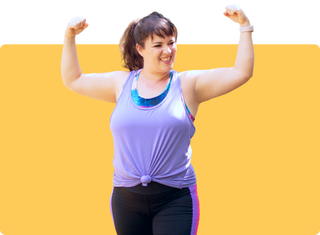 Smiling woman in purple workout clothes flexing her biceps against a yellow background
