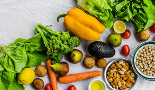 Picture of assorted fruits, vegtables, and nuts high in Vitamin A.