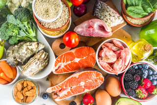 Picture of foods high in Vitamin D including seafood, eggs, nuts, and vegetables.