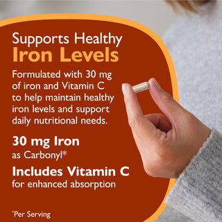 Promotional graphic for an iron supplement showing a hand holding a capsule, with large text stating it supports healthy iron levels and includes Vitamin C.