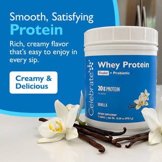 Celebrate Whey Protein powder tub in Vanilla flavor, shown on a white surface with vanilla beans and white orchids. The container has a blue label and is set against a blue promotional background with text reading 'Smooth, Satisfying Protein' and 'Creamy & Delicious'.
